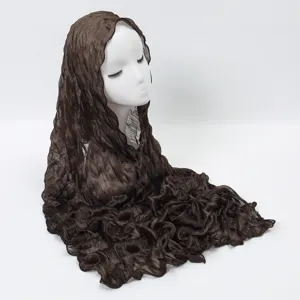 Dark brown crinkle scarf detail, elegant texture fabric closeup showing delicate wrinkles.