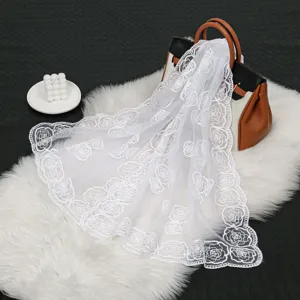 Elegant white lace floral embroidered long scarf, perfect for summer sun protection and stylish fashion outfits.