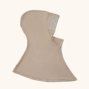 Close-up view of the rhinestone embellished side detail on a casual solid color women hijab cap.
