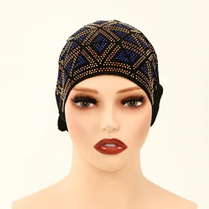 Close-up detail of the stylish black rhinestone turban cap, featuring colorful crystal gems.