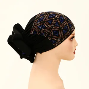Elegant black rhinestone turban hat for women, fashionable chemo cap with geometric crystals.