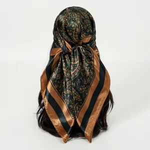 Detail view of the retro vintage satin square headscarf featuring elegant paisley print patterns.