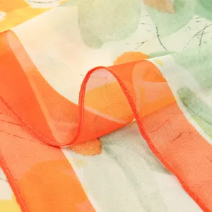 Close-up detail view of women's floral print chiffon scarf, lightweight elegant scarf.