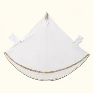Detail view of the white Muslim prayer hijab with elegant gold lace trim and sleeves.