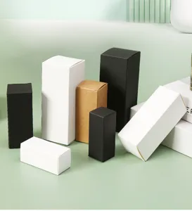 Professional assortment of white, black, and kraft cardboard boxes for cosmetic packaging