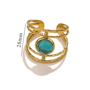 Macro view showing the 28mm height and turquoise stone of this vintage gold open ring.