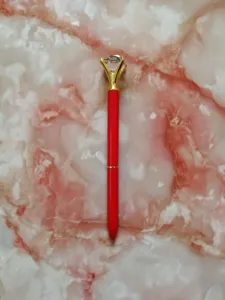Red metal ballpoint pen with a large clear faceted crystal diamond for gift giving