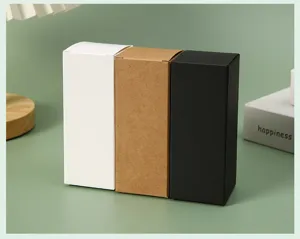 Detail of blank white, kraft, and black folding paper boxes for cosmetic packaging