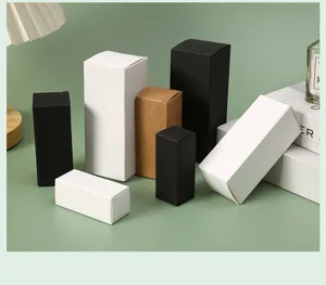 Detail of various paper packaging boxes in white, black, and kraft brown finishes