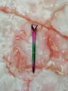 Elegant gradient metal ballpoint pen featuring a large crystal diamond top ornament