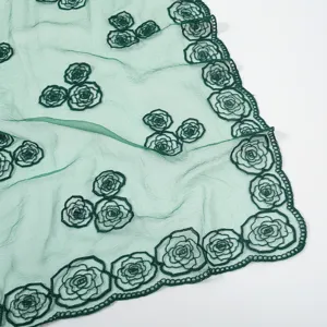 Green embroidered rose gauze scarf, detail view of sheer floral fashion shawl for women.