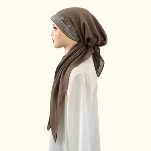 Detailed view of the elegant rhinestone cotton linen hijab, showing soft brown headscarf.