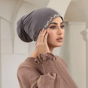 Closeup detail of the elegant grey inner cap hijab featuring sparkling rhinestone trim.
