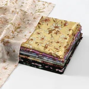 Close-up detail of soft floral printed chiffon scarf fabric stack, elegant and lightweight design.