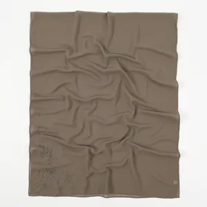 Detailed close-up view of the elegant bow embroidered chiffon hijab scarf, lightweight.