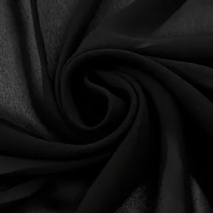 Black chiffon scarf fabric detail, lightweight sheer material, elegant draped texture view.