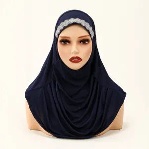 Navy blue pleated instant hijab with sparkling rhinestone trim for elegant Muslim women.