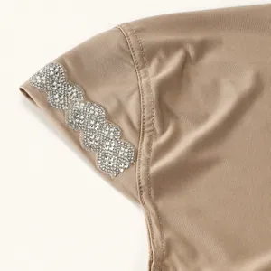 Rhinestone detail close-up of stylish pleated women turban headscarf shawl fabric texture