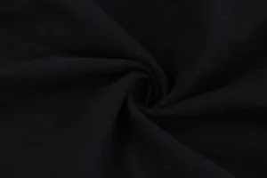 Close-up detail shot of black fabric texture showing soft material and fine weave pattern.