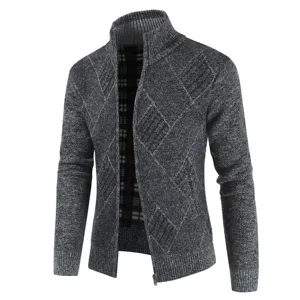 Close-up of men's grey knit cardigan showing textured diamond pattern and high collar zipper.