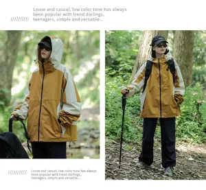Detailed view of the color-blocked hooded windbreaker jacket outdoors in forest scenery.