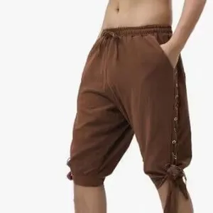 Detailed view of men casual brown shorts with side lace up grommet design and elastic waist.