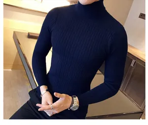 Detail shot of men's dark blue cable knit turtleneck sweater, slim fit and textured wool look.