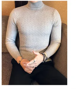 Gray cable-knit turtleneck sweater detail view showing texture and snug long-sleeve fit.