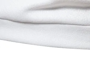 Close-up detail of white knit sweater fabric showing fine texture and soft material weave.