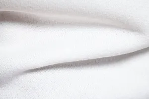 Mens white turtleneck sweater fabric texture detail, fine knitwear close up shot