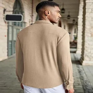 Detail shot of a stylish men's khaki long sleeve textured shirt showing back fabric.