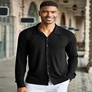 Men black ribbed long sleeve shirt detail view, featuring lapel collar and button front styling.
