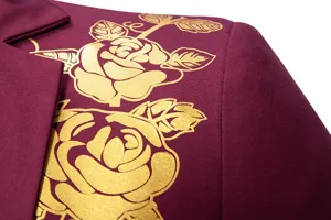 Close-up detail of men's burgundy suit jacket featuring elegant gold foil rose print.