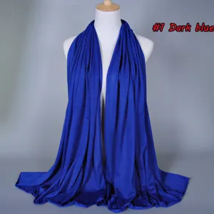 Dark blue solid color cotton modal scarf detail view, soft and breathable fabric.