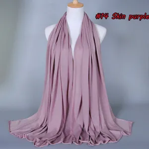 Detailed view of women soft skin purple stretch cotton scarf hijab summer breathable fabric.