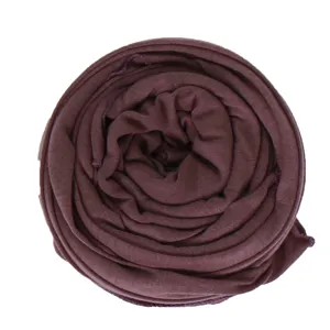 Dark brown knit stretch scarf detail view, soft breathable fabric rolled neatly closeup.