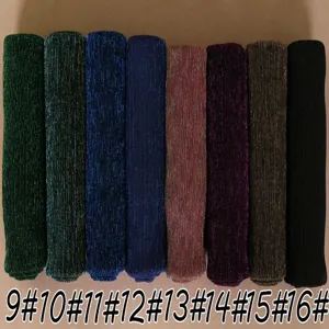 Detail view of metallic shimmering pleated women long scarves in various rich colors display.