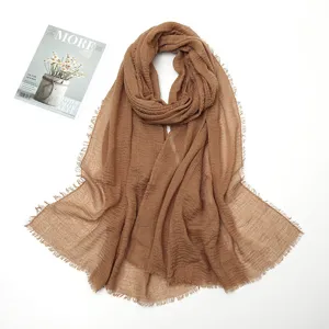 Brown crinkle cotton linen scarf with raw fringed edges, soft lightweight fashion wrap shawl.