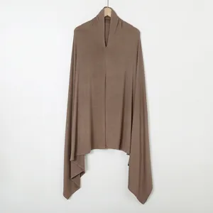 Detailed view of brown instant hijab, soft jersey fabric, equal length sides, solid color.