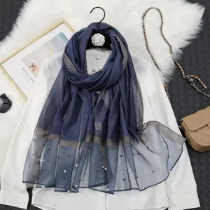 Blue organza shawl for women, featuring glitter stripes and pearl beads. Elegant sun scarf.
