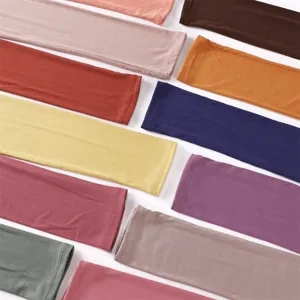 Detailed view of soft modal cotton cooling arm sleeves in various vibrant solid colors.