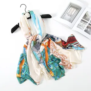 Elegant satin silk long scarf featuring vibrant peacock feather and traditional print.