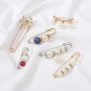 Set of elegant pearl and crystal safety pin brooches for women clothing and waist decor.