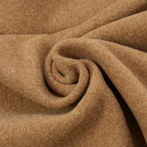 Close-up of soft brown thermal fleece fabric showing fine texture and warm material details.
