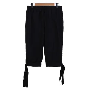 Black loose cropped pants detail, elastic waist and tie-up cuff design for retro style.