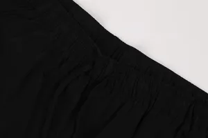 Detailed close-up view of black medieval vintage elastic waistband and drawstring shorts