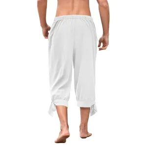 Detail view of men's Renaissance medieval lace-up capri pants in white with elastic waist.
