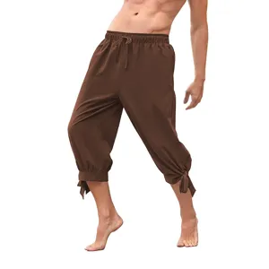 Brown medieval vintage capri pants detail shot, loose drawstring cotton linen retro trousers.