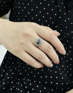 Detailed view of vintage silver ring with engraved letter A and intricate patterns