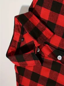 Close-up detail of mens red and black plaid flannel shirt collar with button and size tag.